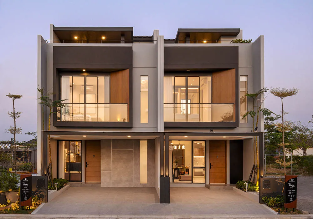 Ilustrasi rumah modern tropis di Surabaya Barat dengan fasad minimalis, balkon kaca, dan konsep hunian keluarga 2 lantai.
